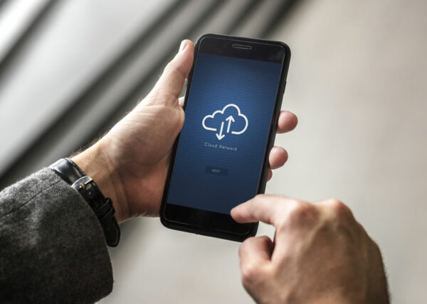 Adant cloud sync use case - Man checking the cloud network on his phone - adant.com